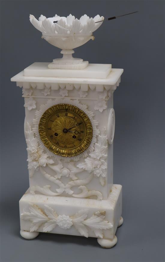 A 19th century French carved alabaster clock